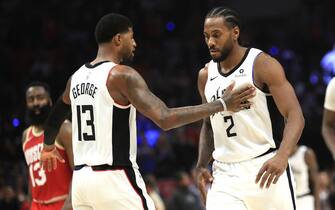 LOS ANGELES, CALIFORNIA - NOVEMBER 22:  Kawhi Leonard #2 is congratulated by Paul George #13 of the Los Angeles Clippers during the second half of a game against the Houston Rockets at Staples Center on November 22, 2019 in Los Angeles, California.  NOTE TO USER: User expressly acknowledges and agrees that, by downloading and/or using this photograph, user is consenting to the terms and conditions of the Getty Images License Agreement (Photo by Sean M. Haffey/Getty Images)