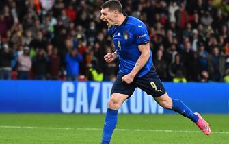 epa09327398 Andrea Belotti of Italy celebrates after scoring during the penalty shoot-out of the UEFA EURO 2020 semi final between Italy and Spain in London, Britain, 06 July 2021.  EPA/Justin Tallis / POOL (RESTRICTIONS: For editorial news reporting purposes only. Images must appear as still images and must not emulate match action video footage. Photographs published in online publications shall have an interval of at least 20 seconds between the posting.)