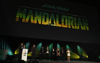 LONDON, ENGLAND - APRIL 07: (L-R) Ali Plumb, Kathleen Kennedy, John Favreau, Dave Filoni, Rick Famuyiwa, Giancarlo Esposito, Katee Sackhoff, Carl Weathers and Emily Swallow onstage during the studio panel for The Mandalorian at the Star Wars Celebration 2023 in London at ExCel on April 07, 2023 in London, England. (Photo by Kate Green/Getty Images for Disney)
