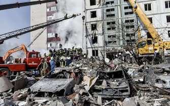 epa10595917 Rescuers work at the site of a damaged residential building after a missile attack, in Uman, Cherkasy region, central Ukraine, 28 April 2023, amid Russia's invasion. At least six people were killed as a result of a rocket attack in Uman, and nine others injured, the Head of the Cherkasy Regional Military Administration, Ihor Taburets wrote on telegram. Ukraine's Ministry of Internal Affairs said on 28 April, that the Russian army conducted attacks on residential buildings across the country, including Dnipro, Uman and Ukrainka in the Kyiv region. Russian troops entered Ukrainian territory in February 2022, starting a conflict that has provoked destruction and a humanitarian crisis.  EPA/OLEG PETRASYUK