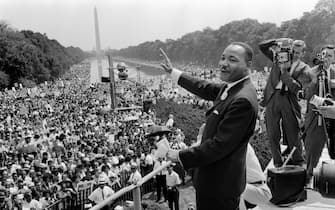 TOPSHOT - The civil rights leader Martin Luther King (C) waves to supporters 28 August 1963 on the Mall in Washington DC (Washington Monument in background) during the "March on Washington". - King said the march was "the greatest demonstration of freedom in the history of the United States." Martin Luther King was assassinated on 04 April 1968 in Memphis, Tennessee. James Earl Ray confessed to shooting King and was sentenced to 99 years in prison. King's killing sent shock waves through American society at the time, and is still regarded as a landmark event in recent US history. AFP PHOTO (Photo by AFP) (Photo by -/AFP via Getty Images)