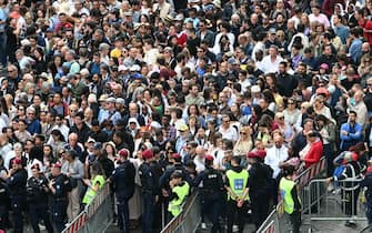 People queue at security checks to enter at St Peter's square, on the day Pope Leo XIV leads the Regina Caeli prayer, in Rome, taken from the Vatican, on May 11, 2025. (Photo by Stefano Rellandini / AFP)