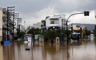 epa10843202 A bus is brought out of a flooded road during the storm named Daniel in the area of Volos, Magnesia, Greece, 06 September 2023. The storm 'Daniel' sweeping through most of Greece with heavy rain and lightning caused extensive damage in the power network at Volos, Mt. Pilio, elsewhere in the Magnissia prefecture, as well as in the Sporades Islands.  EPA/YANNIS KOLESIDIS