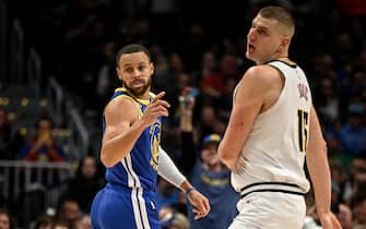 DENVER, CO - FEBRUARY 2: Nikola Jokic (15) of the Denver Nuggets and Stephen Curry (30) of the Golden State Warriors face off during the first quarter at Ball Arena in Denver on Thursday, February 2, 2023. (Photo by AAron Ontiveroz/MediaNews Group/The Denver Post via Getty Images)