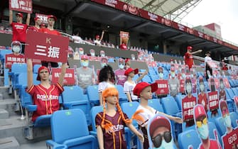 Mannequins and fake masked audience placards are placed at the Taoyuan Baseball stadium before the opening match for the Chinese Professional Baseball League (CPBL) in Taoyuan on April 11, 2020. - The match is called off due to the heavy rain. (Photo by Alex Lee / AFP) (Photo by ALEX LEE/AFP via Getty Images)