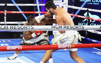 LAS VEGAS, NEVADA - JUNE 09: In this handout image provided by Top Rank, Guido Vianello punches Don Haynesworth during their heavyweight bout at MGM Grand Conference Center Grand Ballroom on June 09, 2020 in Las Vegas, Nevada. (Photo by Mikey Williams/Top Rank via Getty Images)