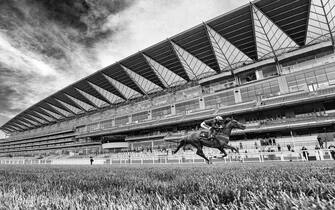 1250488279 ASCOT, ENGLAND - JUNE 18: (EDITORS NOTE: This image was processed using digital filters) Frankie Dettori riding Stradivarius win The Gold Cup on Day Three of Royal Ascot at Ascot Racecourse on June 18, 2020 in Ascot, England. The Queen will miss out on attending Royal Ascot in person for the first time in her 68 year reign. Her Majesty is reported to be planning to watch the racing from home at Windsor Castle, but she will not be able to attend, as the meet goes on behind closed doors due to the Covid-19 pandemic. (Photo by Alan Crowhurst/Getty Images)
