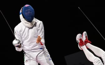 TOPSHOT - Italy's Enrico Garozzo (L) reacts as Japan's Koki Kano falls down during the men's epee individual qualifying bout during the Tokyo 2020 Olympic Games at the Makuhari Messe Hall in Chiba City, Chiba Prefecture, Japan, on July 25, 2021. (Photo by Mohd RASFAN / AFP) (Photo by MOHD RASFAN/AFP via Getty Images)