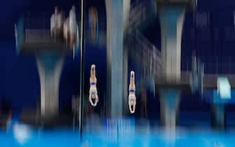 TOPSHOT - Russia's Aleksandr Bondar and Russia's Viktor Minibaev compete to win bronze in the men's synchronised 10m platform diving final event during the Tokyo 2020 Olympic Games at the Tokyo Aquatics Centre in Tokyo on July 26, 2021. (Photo by Odd ANDERSEN / AFP) (Photo by ODD ANDERSEN/AFP via Getty Images)