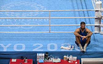 TOPSHOT - France's Mourad Aliev waits outside the ring after losing by disqualification against Britain's Frazer Clarke during their men's super heavy (over 91kg) quarter-final boxing match during the Tokyo 2020 Olympic Games at the Kokugikan Arena in Tokyo on August 1, 2021. (Photo by Luis ROBAYO / AFP) (Photo by LUIS ROBAYO/AFP via Getty Images)