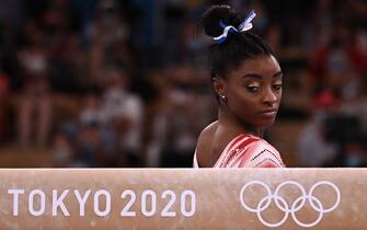 TOPSHOT - USA's Simone Biles gets ready to compete in the artistic gymnastics women's balance beam final of the Tokyo 2020 Olympic Games at Ariake Gymnastics Centre in Tokyo on August 3, 2021. (Photo by Lionel BONAVENTURE / AFP) (Photo by LIONEL BONAVENTURE/AFP via Getty Images)