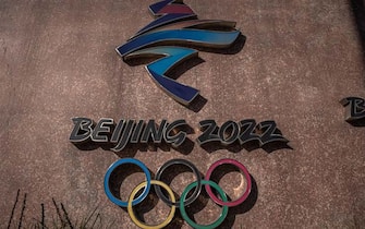 epa09614042 The 2022 Beijing Winter Olympic emblem is seen next to the headquarters of the 2022 Beijing Winter Olympics organising committee, at the Shougang Industrial Park, which will be used as a venue for hosting sport and other events during Beijing 2022 Winter Olympics, in Beijing, China, 01 December 2021. According to China's epidemiologist experts, the new Omicron COVID-19 variant, which poses a high risk globally, at this moment wouldn't have a strong impact on China, which is scheduled in two months to host The 2022 Beijing Winter Olympics followed by the Paralympics.  EPA/ROMAN PILIPEY