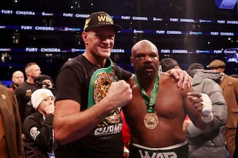 LONDON, ENGLAND - DECEMBER 03: Tyson Fury interacts with  Derek Chisora after victory in the WBC World Heavyweight Title fight between Tyson Fury and Derek Chisora at Tottenham Hotspur Stadium on December 03, 2022 in London, England. (Photo by Warren Little/Getty Images)