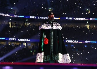 LONDON, ENGLAND - DECEMBER 03: Derek Chisora walks to the ring before his WBC heavyweight championship fight with Tyson Fury, at Tottenham Hotspur Stadium on December 03, 2022 in London, England. (Photo by Mikey Williams/Top Rank Inc via Getty Images)