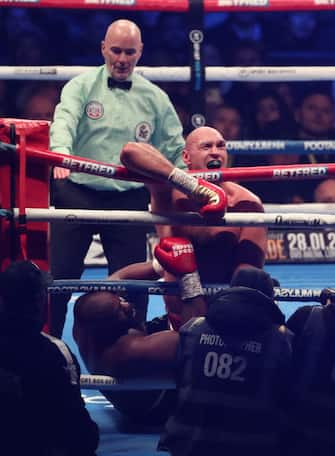 LONDON, ENGLAND - DECEMBER 03: Fury hangs on to the ropes as Chisora is on the floor during the Tyson Fury v Derek Chisora Heavyweight Boxing at Tottenham Hotspur Stadium on December 3, 2022 in London, England. (Photo by Mark Leech/Offside/Offside via Getty Images)
