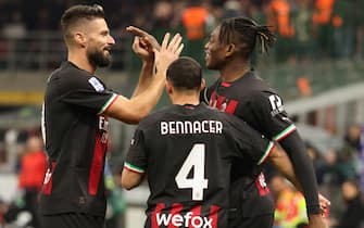 AC Milan s Rafael Leao (R)  jubilates with his teammates  after scoring goal of 1 to 0 during the Italian serie A soccer match between AC Milan and Fiorentina at Giuseppe Meazza stadium in Milan, 13 November 2022.ANSA / MATTEO BAZZI