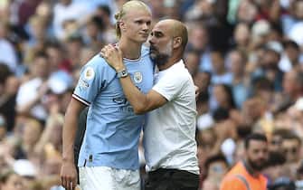 epa10118929 Manchester City manager Pep Guardiola (R) hugs his player Erling Haaland (L) after substitution during the English Premier League soccer match between Manchester City and AFC Bournemouth in Manchester, Britain, 13 August 2022.  EPA/PETER POWELL EDITORIAL USE ONLY. No use with unauthorized audio, video, data, fixture lists, club/league logos or 'live' services. Online in-match use limited to 120 images, no video emulation. No use in betting, games or single club/league/player publications
