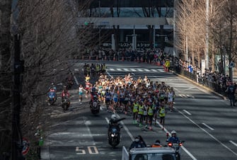 TOKYO, JAPAN - MARCH 01: Elite runners take part in the Tokyo Marathon on March 1, 2020 in Tokyo, Japan. The 2020 Tokyo Marathon has been restricted to elite runners only as measures get underway in Japan to combat the Covid-19 virus. A growing number of events and sporting fixtures have been cancelled or postponed while some businesses are closing or asking their employees to work from home. Prime Minister Shinzo Abe has also asked schools to close for around a month from tomorrow as coronavirus cases increase and concerns mount over the effect the outbreak will have on the Tokyo Olympics. (Photo by Carl Court/Getty Images)