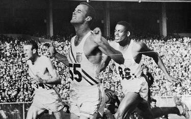 (Original Caption) 11/27/1956-Melbourne, Australia- Bobby Morrow, San Benito, Texas speedster, leads teammates Andy Stanfield (R, background) and Thane Baker (L) of Elkhart Kansas to the wire to win a clean sweep for the United States in the 200-meter dash in the Olympic games. Stanfield finished second and Baker came in third. time for the event was 20.6, a new Olympic record.