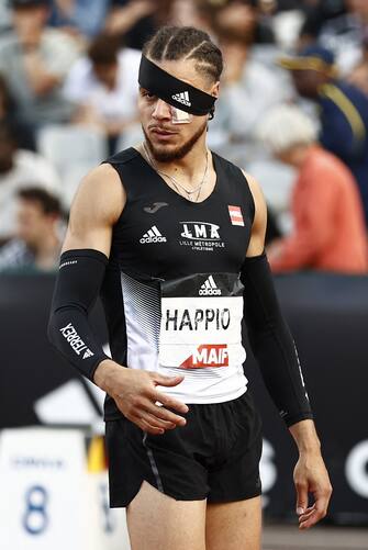 France's Wilfried Happio wears a bandage after being assaulted at the warm-up stage   during in the mens 400 metre hurdles final during the French Elite Athletics Championships at the Helitas stadium in Caen, northern France, on June 25, 2022. (Photo by Sameer Al-DOUMY / AFP) (Photo by SAMEER AL-DOUMY/AFP via Getty Images)