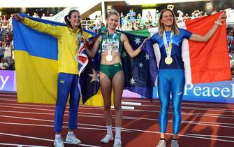 EUGENE, OREGON - JULY 19: Silver medalist Yaroslava Mahuchikh of Team Ukraine, gold medalist Eleanor Patterson of Team Australia, and bronze medalist Elena Vallortigara of Team Italy celebrate after competing in the Women's High Jump Final on day five of the World Athletics Championships Oregon22 at Hayward Field on July 19, 2022 in Eugene, Oregon. (Photo by Patrick Smith/Getty Images)