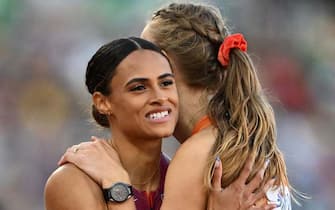 USA's Sydney Mclaughlin (L) hugs Netherlands' Femke Bol after winning the women's 400m final and setting a new a world record during the World Athletics Championships at Hayward Field in Eugene, Oregon on July 22, 2022. (Photo by Jewel SAMAD / AFP) (Photo by JEWEL SAMAD/AFP via Getty Images)
