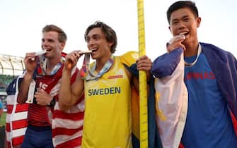 EUGENE, OREGON - JULY 24: Silver medalist Christopher Nilsen of Team United States, gold medalist Armand Duplantis of Team Sweden and bronze medalist Ernest John Obiena of Team Philippines celebrate after competing in the Men's Pole Vault on day ten of the World Athletics Championships Oregon22 at Hayward Field on July 24, 2022 in Eugene, Oregon. (Photo by Christian Petersen/Getty Images)