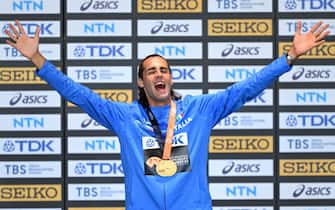 BUDAPEST, HUNGARY - AUGUST 23: Gold medalist Gianmarco Tamberi of Team Italy celebrates on the podium after the Men's High Jump Final during day five of the World Athletics Championships Budapest 2023 at National Athletics Centre on August 23, 2023 in Budapest, Hungary. (Photo by David Ramos/Getty Images)