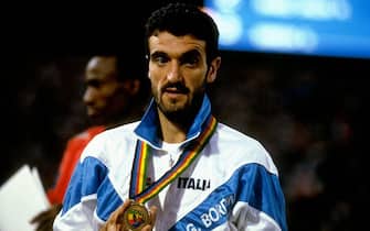 1987:  Portrait of Gelindo Bordin of Italy with the gold medal after his victory in the Marathon during the World Championships at the Olympic Stadium in Rome. \ Mandatory Credit: Tony  Duffy/Allsport