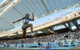 ATHENS - AUGUST 23:  Magdelin Martinez of Italy competes in the women's triple jump final on August 23, 2004 during the Athens 2004 Summer Olympic Games at the Olympic Stadium in the Sports Complex in Athens, Greece.  (Photo by Michael Steele/Getty Images)