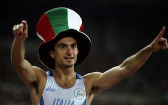 27 Aug 1999:  Fabrizio Mori of Italy celebrates gold in the 400m hurdles during the IAAF World Championships at the Estadio Olimpico in Seville, Span. \ Mandatory Credit: Shaun Botterill /Allsport