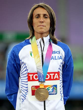 DAEGU, SOUTH KOREA - SEPTEMBER 04:  Antonietta Di Martino of Italy stands on the podium with her bronze medal during the medal ceremony for the women's high jump during day nine of 13th IAAF World Athletics Championships at Daegu Stadium on September 4, 2011 in Daegu, South Korea.  (Photo by Mark Dadswell/Getty Images)