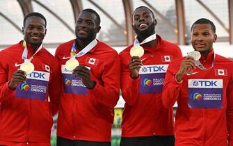 (From L) Gold medallists Canada's Aaron Brown, Jerome Blake, Brendon Rodney and Andre De Grasse pose on the podium during the medal ceremony for the men's 4x100m relay during the World Athletics Championships at Hayward Field in Eugene, Oregon on July 23, 2022. (Photo by Ben Stansall / AFP) (Photo by BEN STANSALL/AFP via Getty Images)