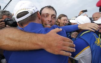 Francesco Molinari hugs Paul Casey after winning his match and the Ryder Cup on the 16th tee during day three of the 2018 Ryder Cup at Le Golf National near Versailles on September 30th 2018 in France (Photo by Tom Jenkins)