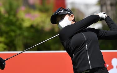 South Korean golfer Kang Ji-won tees off while wearing a face mask on the 10th hole during a practice session ahead of the 42nd KLPGA Championship at Lakewood Country Club in Yangju, northeast of Seoul, on May 13, 2020. - Leading professional golfers will return to competitive action for the first time in months after the coronavirus shutdown when three of the world's top 10 women tee off in South Korea on May 14. (Photo by Jung Yeon-je / AFP) (Photo by JUNG YEON-JE/AFP via Getty Images)