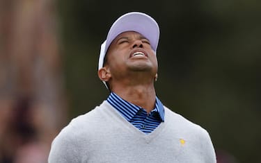 epa08067900 Playing Captain Tiger Woods of the United States team reacts after missing his putt on the first green during day two of the 2019 Presidents Cup golf tournament at the Royal Melbourne Golf Club in Melbourne, Australia, 13 December 2019.  EPA/SCOTT BARBOUR AUSTRALIA AND NEW ZEALAND OUT  EDITORIAL USE ONLY