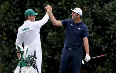 AUGUSTA, GEORGIA - NOVEMBER 10:  Jon Rahm of Spain celebrates with his Adam Hayes after skipping in for a hole in one on the 16th during a practice round prior to the Masters at Augusta National Golf Club on November 10, 2020 in Augusta, Georgia. (Photo by Rob Carr/Getty Images)