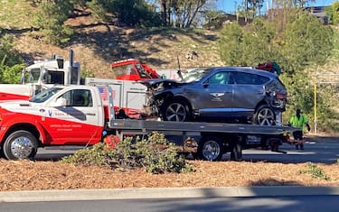 The vehicle driven by Tiger Woods on the back of a truck in Los Angeles after he suffered leg injuries when the vehicle rolled over and is now in hospital undergoing surgery. Picture date: Tuesday February 23, 2021.