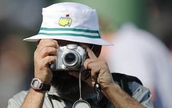 epa06644217 A patron takes photos in Amen Corner  during the second practice round at the 2018 Masters Tournament at the Augusta National Golf Club in Augusta, Georgia, USA, 03 April 2018. The 2018 Masters Tournament is held 05 April through 08 April 2018.  EPA/ERIK S. LESSER