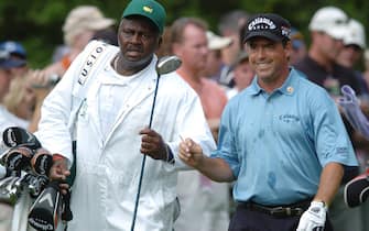 Caddie Buck Moore, of Augusta, takes the driver from Olin Browne as they leave the 14th teebox during Monday's practice round of the 2006 Masters at the Augusta National Golf Club Monday April 3, 2006.

Syndication The Augusta Chronicle (Photo by ANDREW DAVIS TUCKER / USA Today Network/Sipa USA)