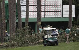 epa10564255 A large tree is on the ground near the 17th tee during a suspension in play due to weather, in the second round of the Masters Tournament at the Augusta National Golf Club in Augusta, Georgia, USA, 07 April 2023. The Augusta National Golf Club will hold the Masters Tournament from 06 April through 09 April 2023.  EPA/ERIK S. LESSER