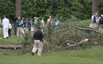 epa10564252 A large tree is on the ground near the 17th tee during a suspension in play due to weather, in the second round of the Masters Tournament at the Augusta National Golf Club in Augusta, Georgia, USA, 07 April 2023. The Augusta National Golf Club will hold the Masters Tournament from 06 April through 09 April 2023.  EPA/ERIK S. LESSER