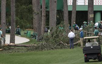 epa10564203 A large tree is on the ground near the 17th tee during a suspension in play due to weather, in the second round of the Masters Tournament at the Augusta National Golf Club in Augusta, Georgia, USA, 07 April 2023. The Augusta National Golf Club will hold the Masters Tournament from 06 April through 09 April 2023.  EPA/ERIK S. LESSER