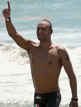 ROME - JULY 25:  Valerio Cleri of Italy celebrates winning the Men's 25 Km Open Water Swimming during the 13th FINA World Championships at Ostia Beach on July 25, 2009 in Rome, Italy.  (Photo by Quinn Rooney/Getty Images)