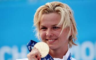 ROME - AUGUST 02:  Britta Steffen of Germany receives the gold medal during the medal ceremony for the Women's 50m Freestyle Final during the 13th FINA World Championships at the Stadio del Nuoto on August 2, 2009 in Rome, Italy.  (Photo by Quinn Rooney/Getty Images)