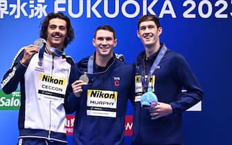 (L-R) Silver medallist Italy's Thomas Ceccon, gold medallist USA's Ryan Murphy and bronze medallist USA's Hunter Armstrong pose during the medals ceremony for the men's 100m backstroke swimming event during the World Aquatics Championships in Fukuoka on July 25, 2023. (Photo by Philip FONG / AFP) (Photo by PHILIP FONG/AFP via Getty Images)