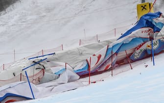Blown fences and banners are pictured in the finish area of the FIS Alpine Ski Women's Giant Slalom World Cup event in Semmering, Austria, on December 28, 2020. - The Alpine Skiing World Cup in Semmering, whose first run was contested in the morning, was called off due to the wind blowing over the Austrian resort, the International Ski Federation (FIS) announced on December 28. (Photo by Erich SPIESS / various sources / AFP) / Austria OUT (Photo by ERICH SPIESS/EXPA/AFP via Getty Images)