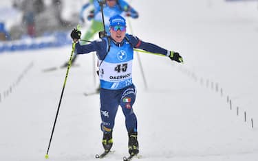 08 January 2021, Thuringia, Oberhof: Biathlon: World Cup, Sprint 10 km, Men. Lukas Hofer from Italy crosses the finish line. Photo: Martin Schutt/dpa-Zentralbild/dpa