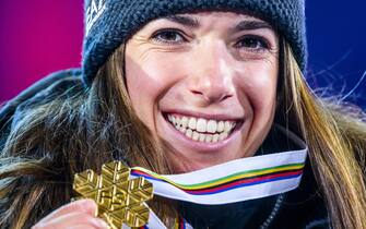 epa10455132 Gold medalist Marta Bassino of Italy smiles during the medals ceremony the women's super-g race at the 2023 FIS Alpine Skiing World Championships in Meribel, France, 08 February 2023.  EPA/JEAN-CHRISTOPHE BOTT