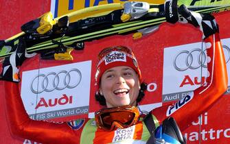 epa00126596 Italian Isolde Kostnercelebrates on the podium after  winning  the downhill World Cup race on the Krummholz piste in Haus / Ennstal on Saturday, 31 January 2004. Isolde Kostner of Italy claimed her first ski racing World Cup win since November 2001 on Saturday in a downhill race. The local heroine Goetschl came second in 1:39.66 minutes and Swiss Frenz Aufdenblatten was third on the podium in 1:39.90 minutes.  EPA/Robert Jaeger